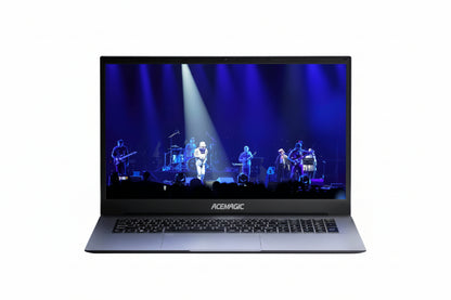 Laptop displaying a concert scene with a band on stage, branded 'Acer Magic'.